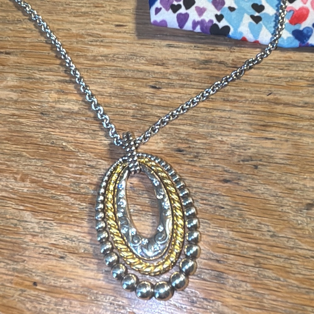 Brighton reversible triple oval pendant necklace in silver tone and gold tone.